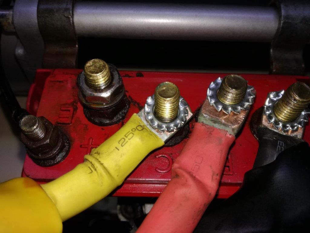 34 reconnecting winch power cables with new star washers.jpg