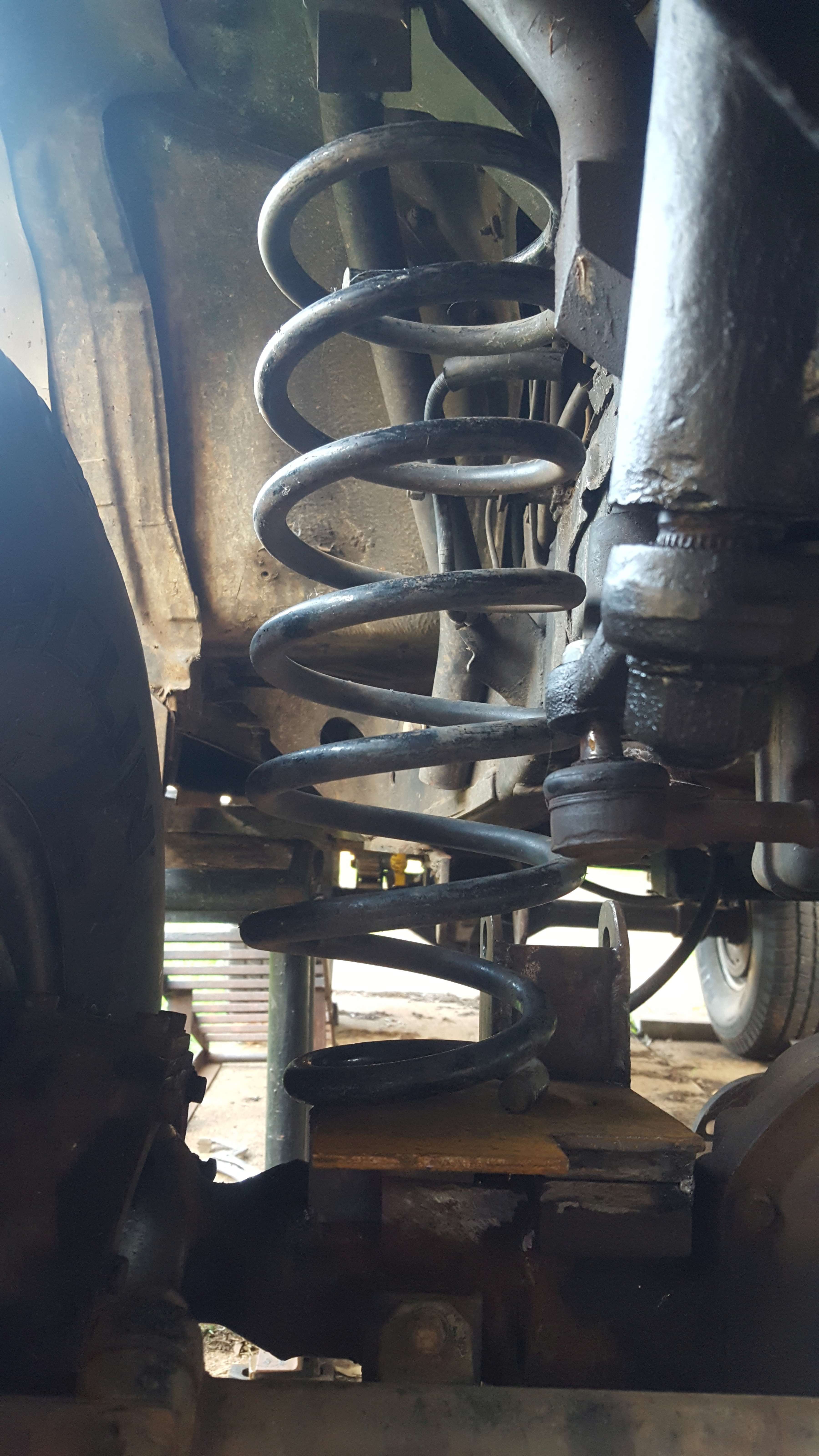 Spring should fit under the chassis according to the measurements I got for under load. I can only figure this out once I can put the car down with the panhard bar in place