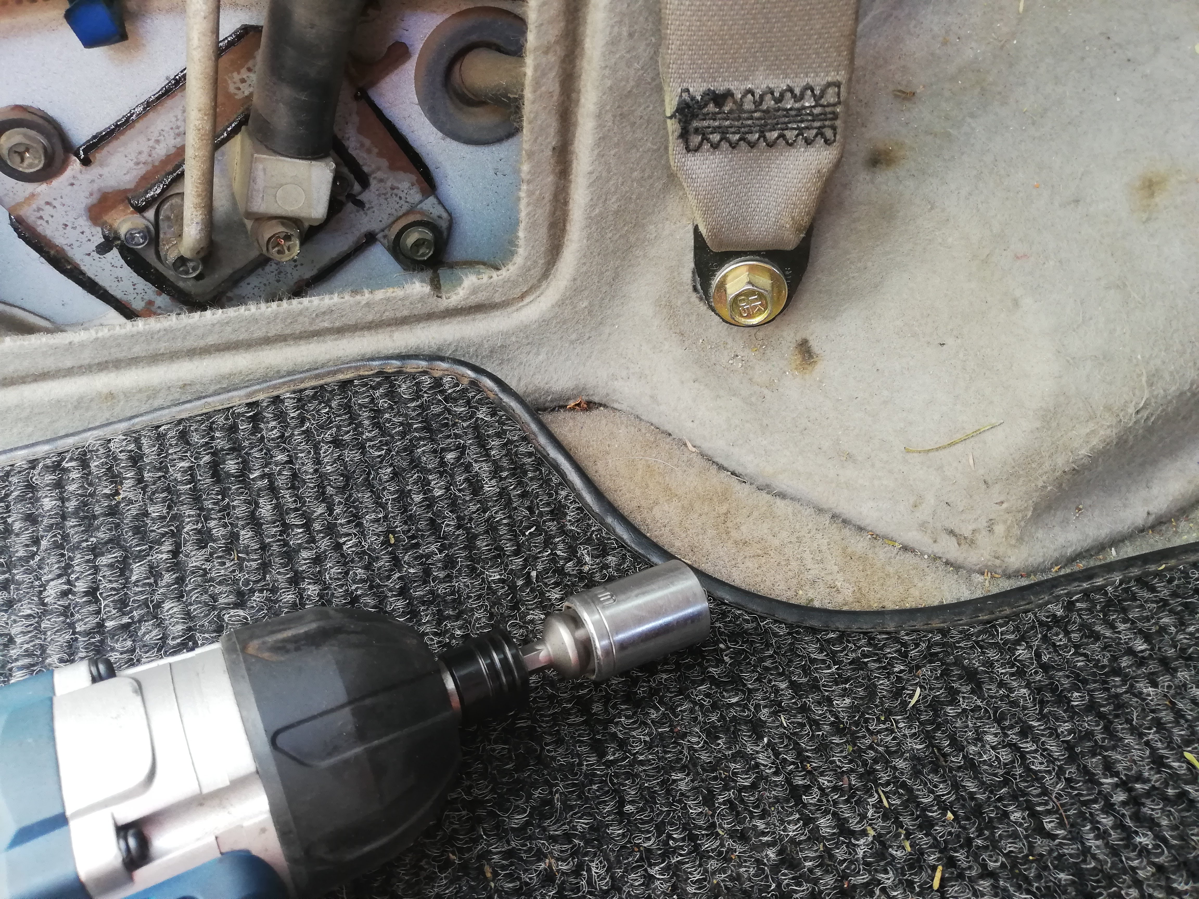Bottom trim seat belt removal.