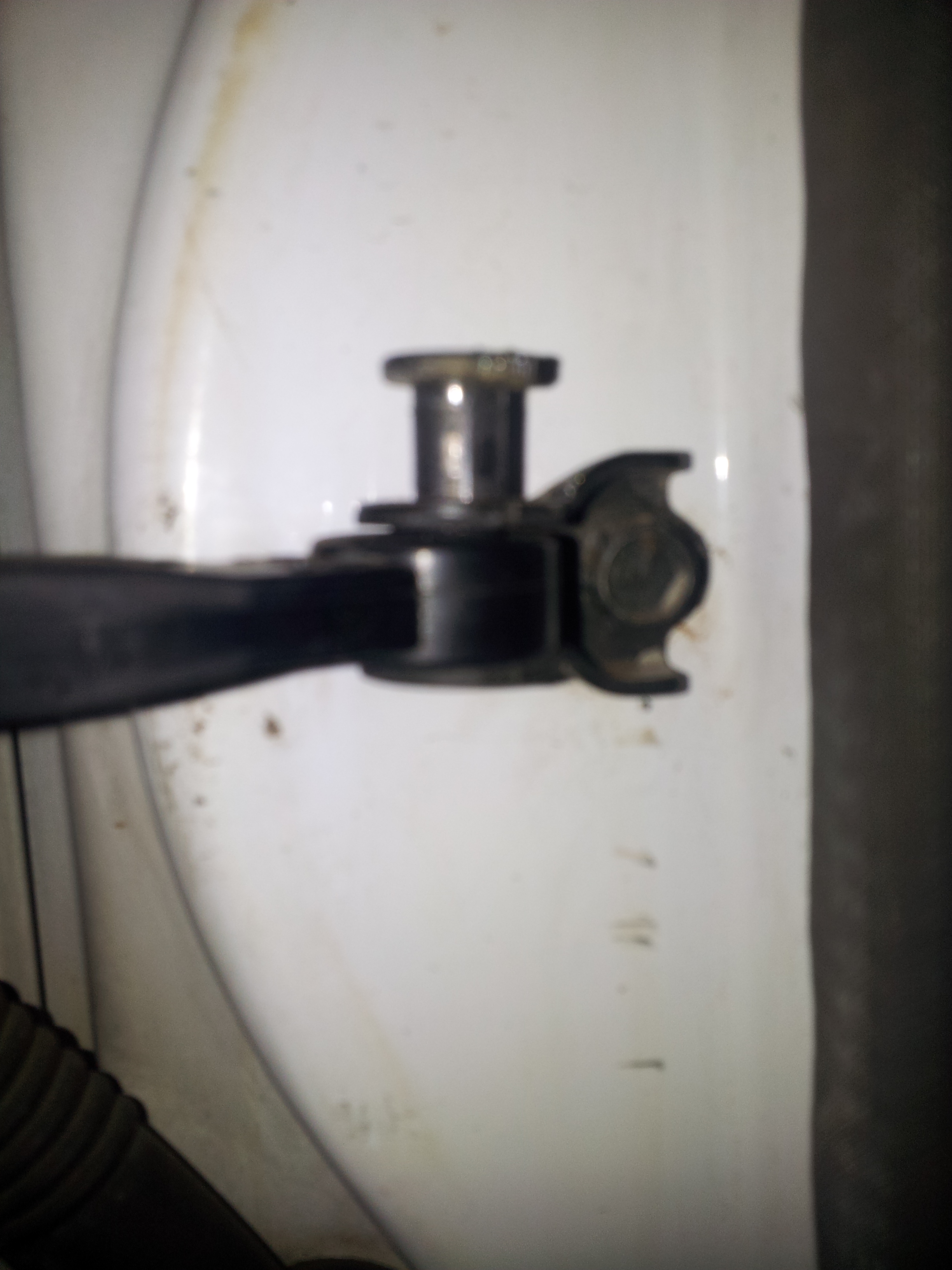 A quick grind with the die grinder on the bottom flared part of the pin and out she came