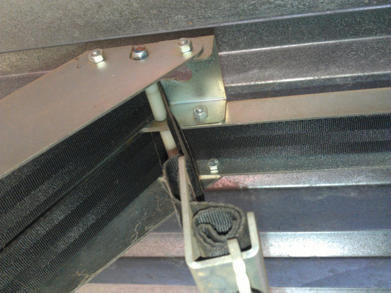 Front left - top part showing both belts and rollers