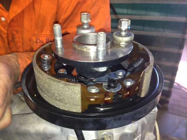 Hand brake mechanism with brake shoes