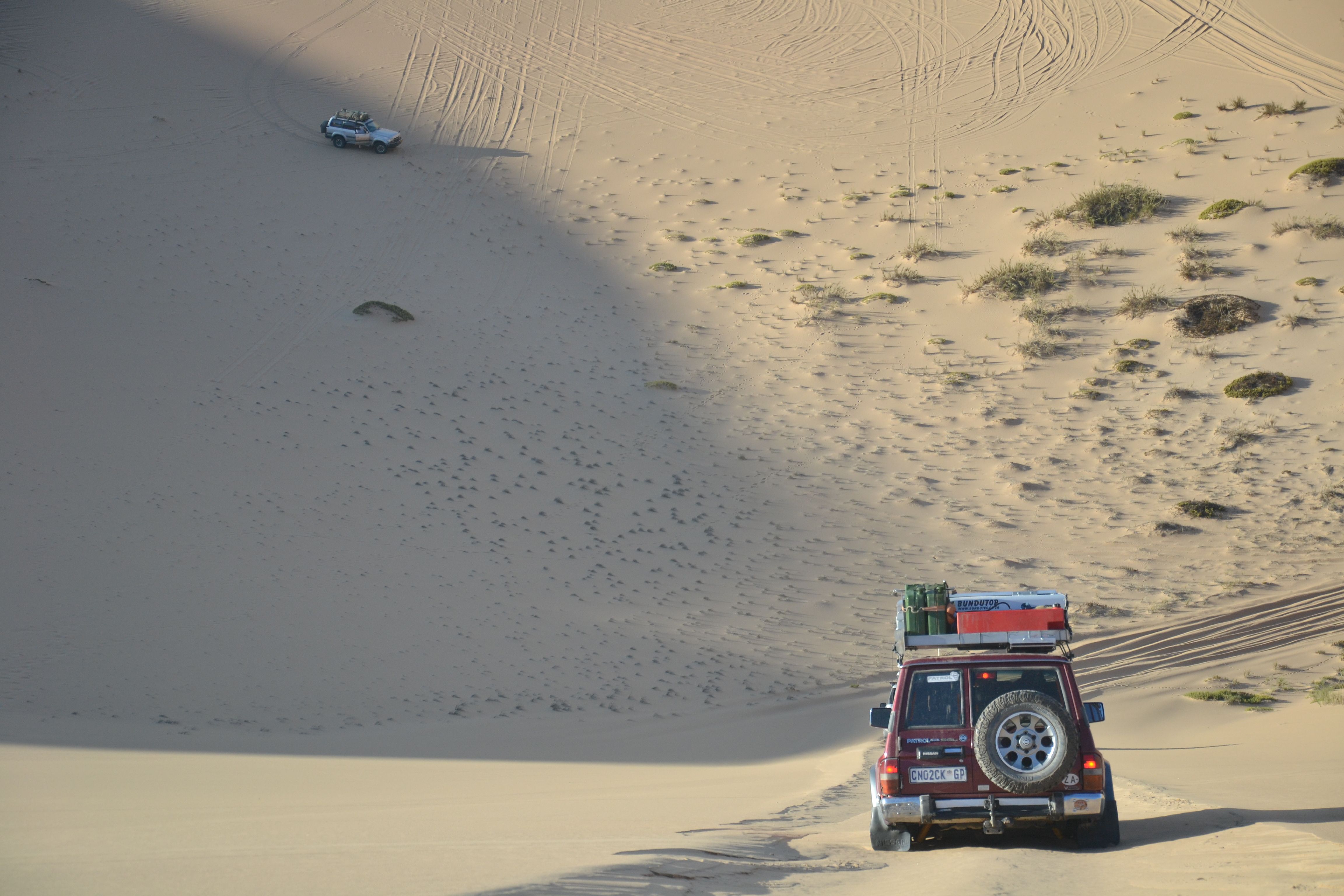 Goping down a 33-degree angle  `100 meter high dune..