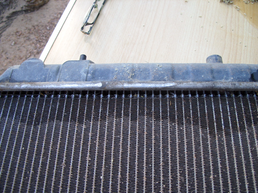 Radiator tubes rubbed through from cowling
