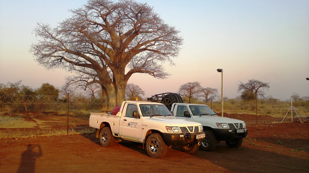 The only two working cars in the camp Tete..jpg